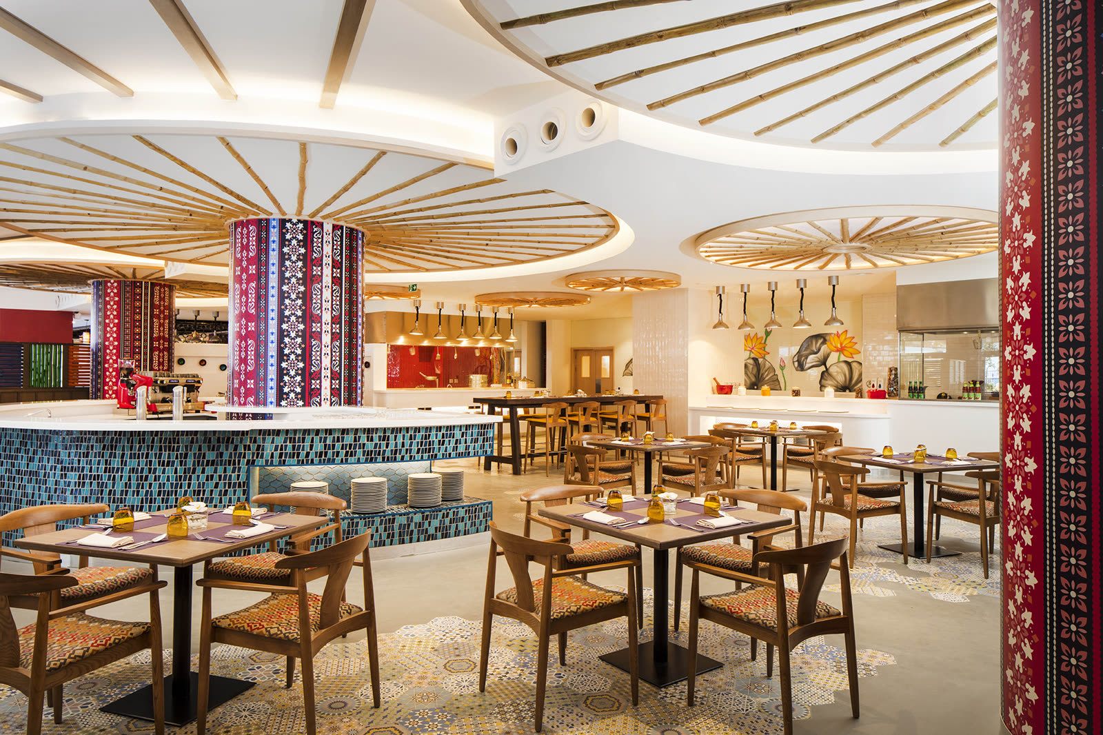 Restaurant with a patterned timber ceiling and a mosaic buffet counter